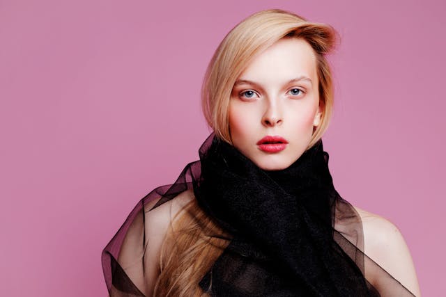 woman with short hair wearing black scarf