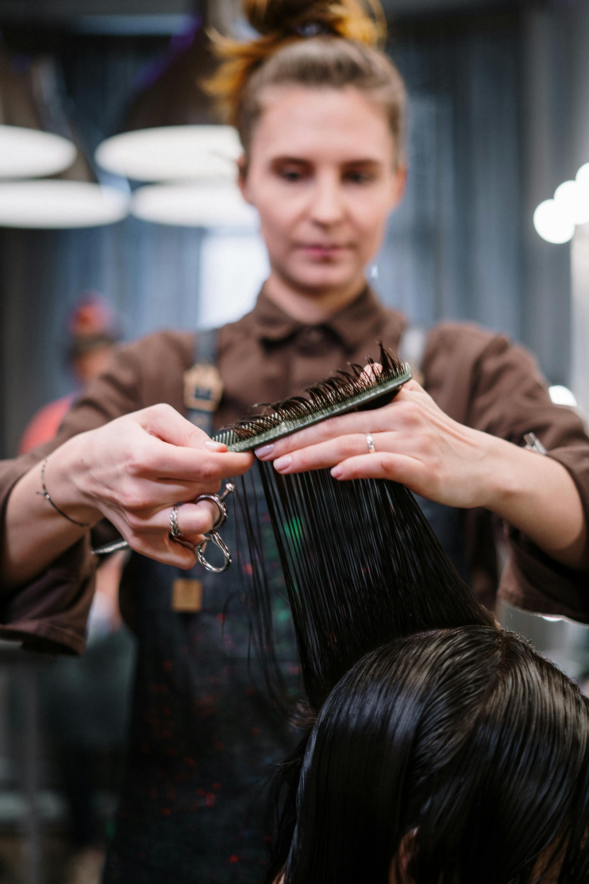 woman getting hair shampoo at salon